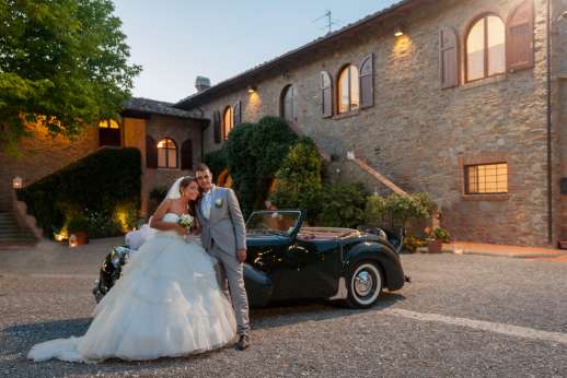 Weddings at Villa Ostignano - The happy couple in the villa courtyard