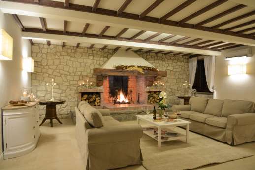 Weddings at Villa Ostignano - Sitting room with working fireplace