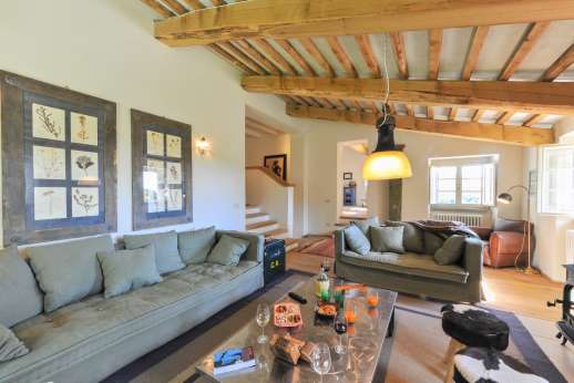 La Palazza Nel Cielo - Upper ground floor sitting room with TV, two sofas, wood stove and access to the back garden.