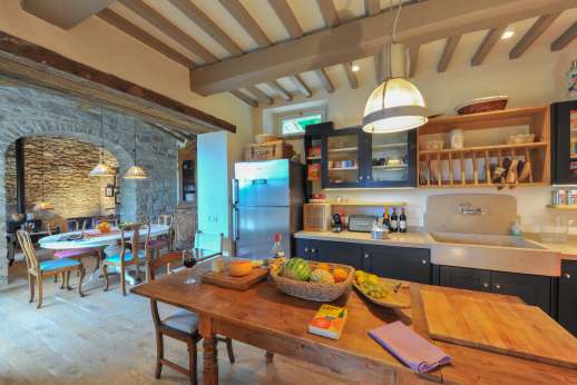 La Palazza Nel Cielo - Kitchen and work table leading though to the informal dining area and sitting room