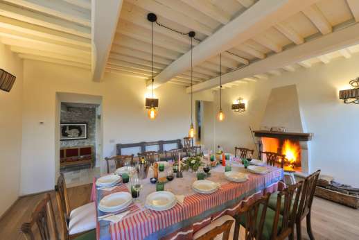 La Palazza Nel Cielo - Ground floor formal dining room with fireplace and table for 14 people and access to the paved courtyard [down 3 steps].