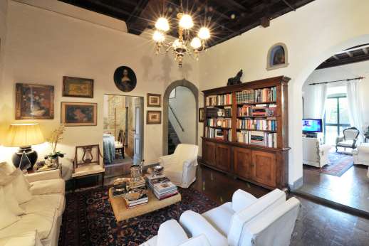 Villa San Martin - Sitting room with view through to another sitting room with TV