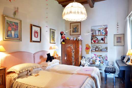 Villa San Martin - Double bedroom [convertible to twin] with a decorative fireplace. Bathroom with shower.