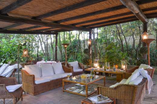 Montesassi - A loggia with seating area.