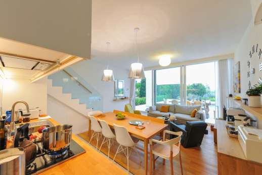 Villa Amerini - The living room sits 5 persons, on 3-seater sofa and 2 armchairs one of which includes a footstool.