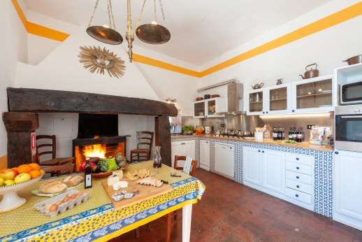 Tizzano - Well equipped kitchen with original fireplace on the ground floor.