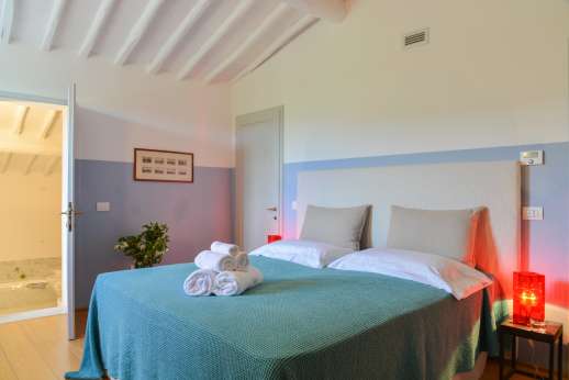 Villa Caprolo - Second floor, double bedroom with en suite bathroom, and geo thermal air conditioning.