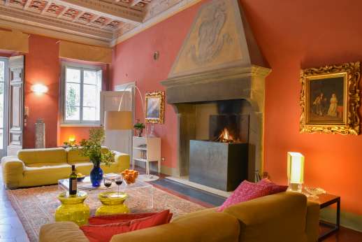 Villa Caprolo - The large living room with a fireplace. Geo thermal heating and air conditioning throughout the property.