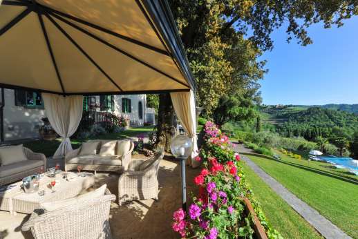 Villa di Pile - A view from the villa across the gardens towards the pool.
