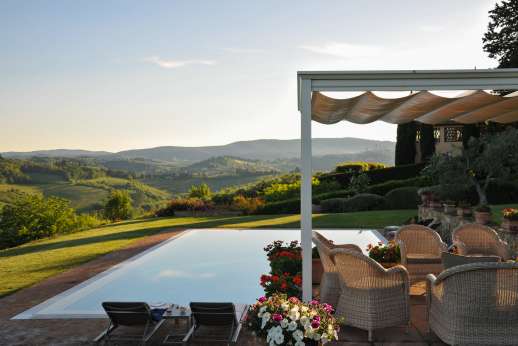 San Leolino (x 10 people) with Staff and Cook - The medieval city of San Gimignano with its towers sits as a back drop to the large infinity-edge swimming pool.