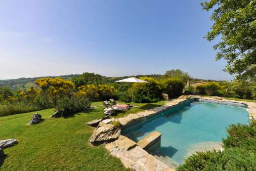 Casetta Termine - A lovely informal garden bordered by fields. The swimming pool, 6 x 10m/19 x 32 feet