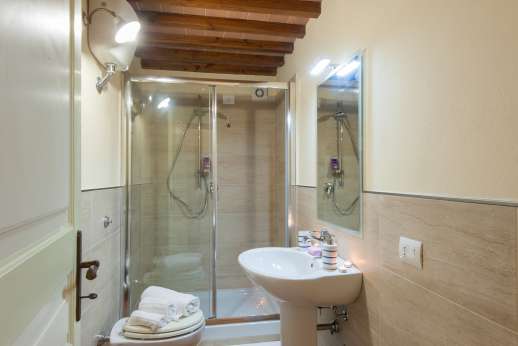 Bathroom with shower next to the bedroom
