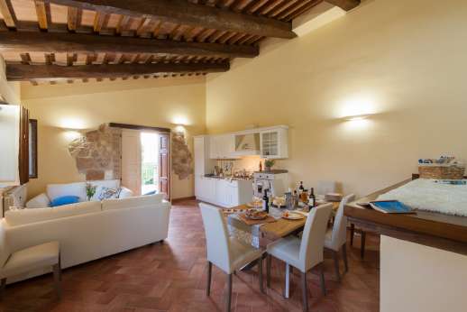 Solomonio  - New Wing/Upper Ground Floor Second small  kitchen with 6 seating dining table and two sofas leading out onto a small terrace