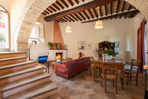 Casa del Poggio - Living room with fireplace also Satellite TV [Sky channels] with DVD.