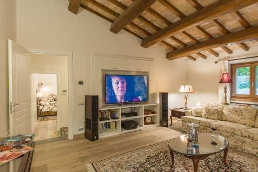 Cipresso Dorato - First floor air-conditioned suite comprised of a living area with 2 large sofas, TV and Hi-Fi system
