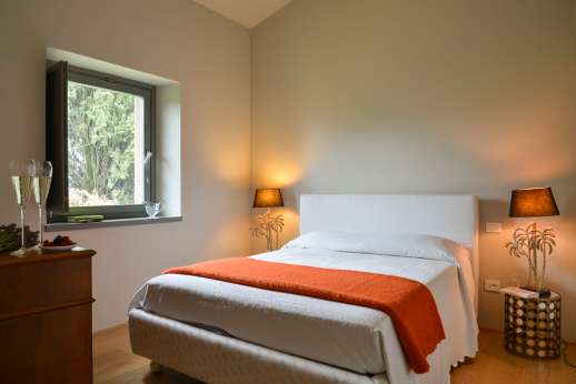Il Soldano - Ground floor double bedroom with a small sitting area with smart tv and external bathroom with shower