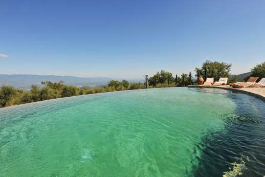Il Cortile Pratolino (x 15 people) with Staff and Cook - The oval swimming pool, 7.5 x 12.5m/24 x 41 feet, has an infinity edge