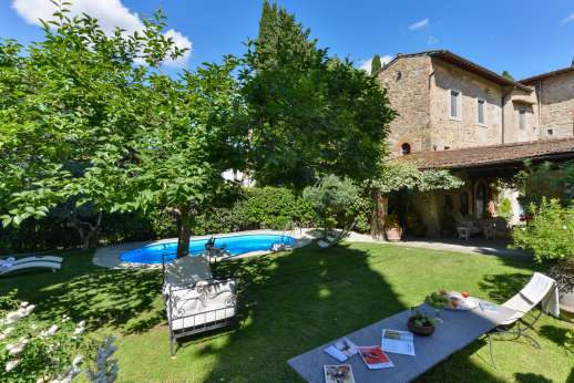 Villa San Martin - The walled and gated garden with well kept lawns gently slopes down to the private salt water swimming pool
