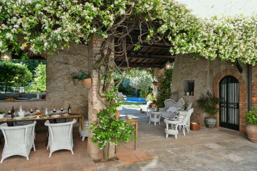 Villa San Martin - Dining area looking though to seating in the loggia and the pool
