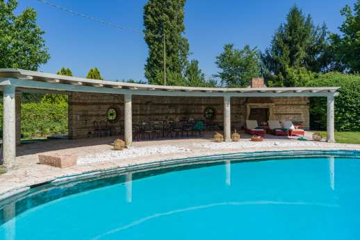 Weddings at Villa Zambonina - Vine covered pergola facing the wonderful lush garden and swimming pool.