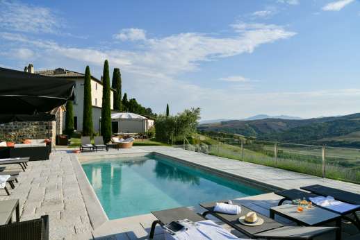 Il Cornello - In true Tuscan style this breathtaking villa is set on a hilltop with a private cypress lined access road, offering spectacular views of the rolling countryside.
