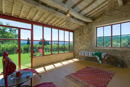 Il Borgo di Petroio- The multi-functional space leads into a small glass-paned relaxation area for massages complete with a massage bed