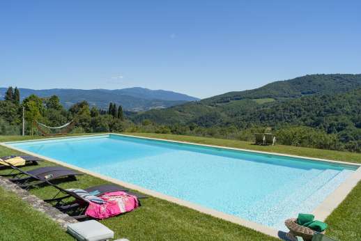The Estate of Petroio with Staff and Cook - The very large, fenced swimming pool, 8 x 18m/26 x 58 feet, is set on a lawned terrace enjoying sun all day and stunning views.