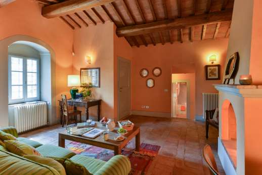 La Sobole - Orange wing sitting room and open fire place