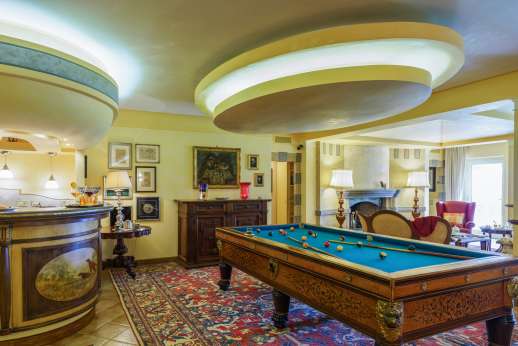 Villa Soele - Main living room with pool table, large TV with English movie channels and doors opening to the covered outdoor dining