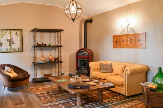 Loliondo - A separate wing of the villa, sitting room with wood-burning stove