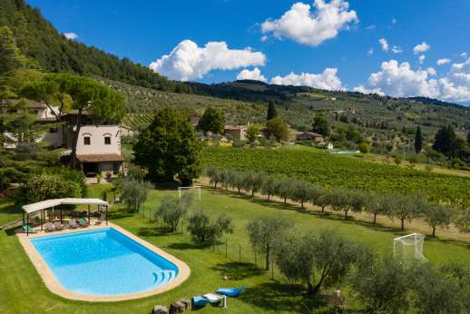 The Estate of Petroio - The very large, fenced swimming pool is set on a lawned terrace 90m/100 yards from the house
