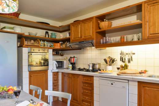 Villa al Monte - Main house a well equipped kitchen leading out to a vine covered terrace for al fresco dining.