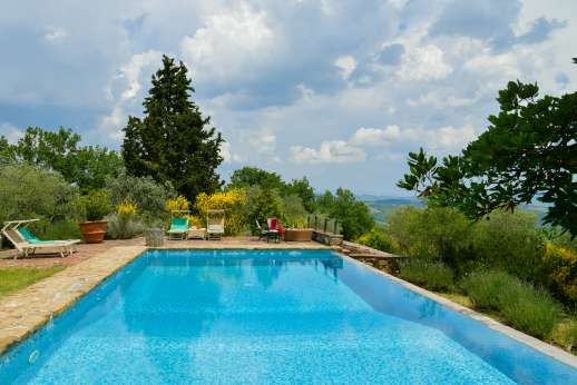 Villa Cignano - The infinity-edged large pool, 6 x 12m/20 x 39 feet, has a depth of 1.2-2.5m/4-8 feet and stone steps for entry/exit.