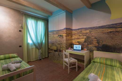 Il Chiesino - First floor air conditioned triple bedroom [one bunk bed and one single bed] and shared bathroom with shower.