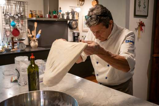 Podere Brogi - One of the staff making pizza dough