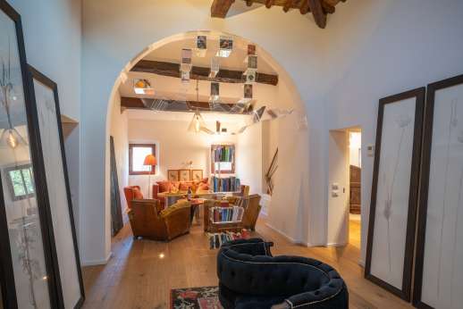 Tenuta Almabrada - Main house Cantina open plan living room with "The Book Tree Bookshelf"