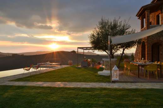 Poggiobuono - Dine al frescoShaded al fresco dining area with table for 10 people next to the kitchen entrance