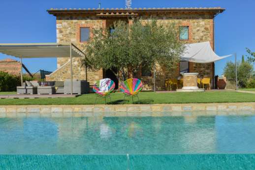 Poggiobuono - The pool and outdoor areas lit for use in the evening