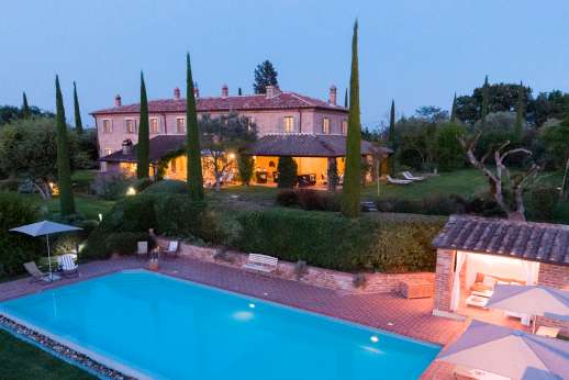 La Badiole - A dining loggia lies on a paved terrace outside the dining room