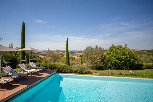 La Badiole - Private solar heated infinity–edge swimming pool, 5.5 x 14.5 meters/18 x 46 feet, lies on a lower terrace while a boule court lies below the pool.