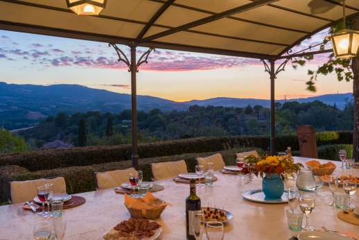 Villa Astori - A pretty outdoor dining pergola with views of the Tuscan rolling hills.