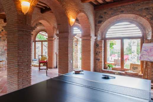 Querciatello - The Stalla, the stables, once housed about 20 oxen used for field work. Now activity room with table tennis, darts and elliptical bike