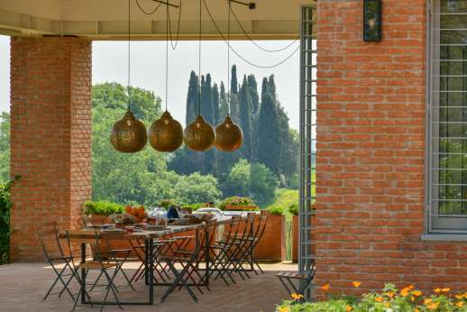 La Casa del Chiu', Sheltered al fresco dining area sits right at the entrance to the converted barn