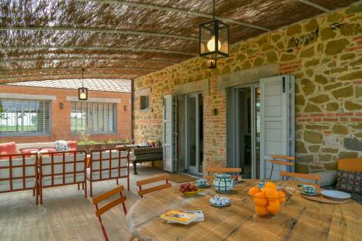 La Casa del Chiu', The main al fresco living area sits under the pergola at the entrance to the farmhouse