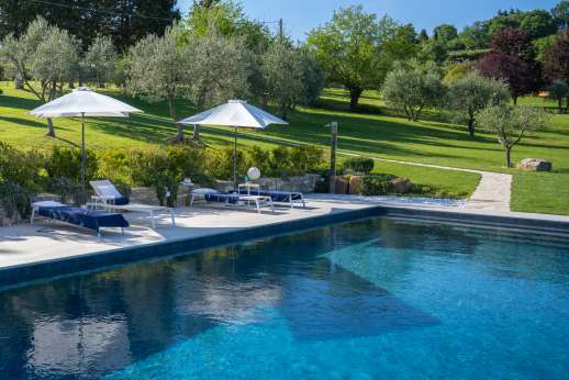 Poggetto Rosato- The extensive lawn leads towards a lovely private swimming pool