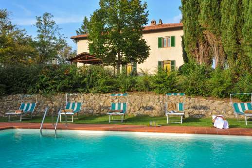 Villa D'Elsa - Villa D'Elsa, the L-shaped infinity edge swimming pool; laced with sun loungers, chairs and umbrellas, with a shallow end for children