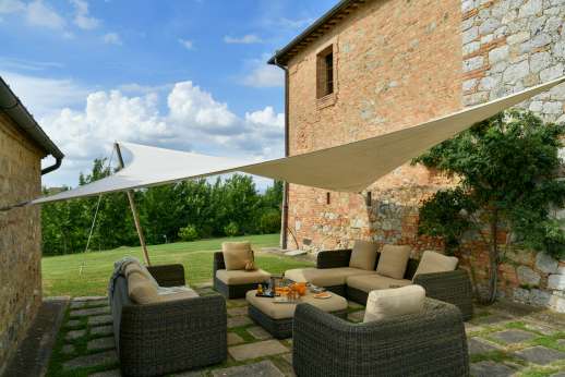 La Piana - Outdoor shaded seating area in between the Villa and pool house.