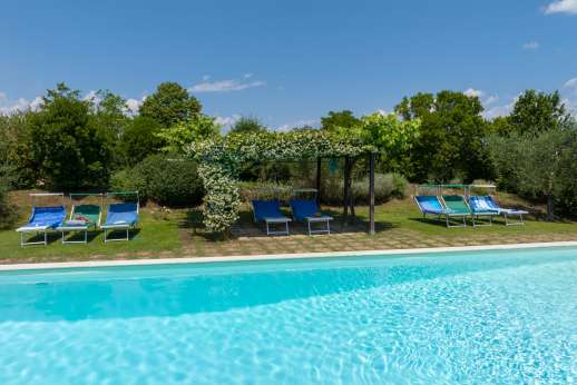 Poggio Alto - The pool terrace with shaded pergola.