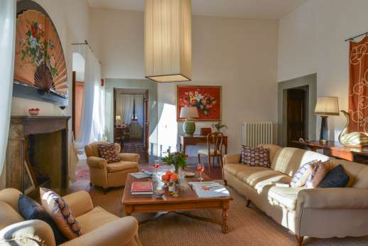 Villa Di Masseto - First floor up 21 stone steps to a sitting room with fireplace.