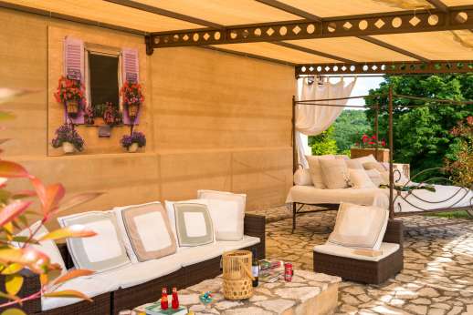 Loliondo - A fully furnished shaded patio to unwind and relax and wooden deck to sunbathe by the water